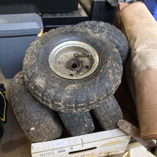 Close-up of a pneumatic barrow wheel with a rubber tyre.