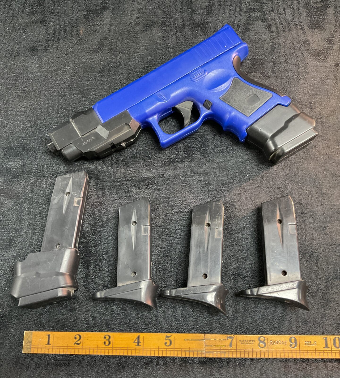 BB gun pistol set with four spare magazines for target practice.