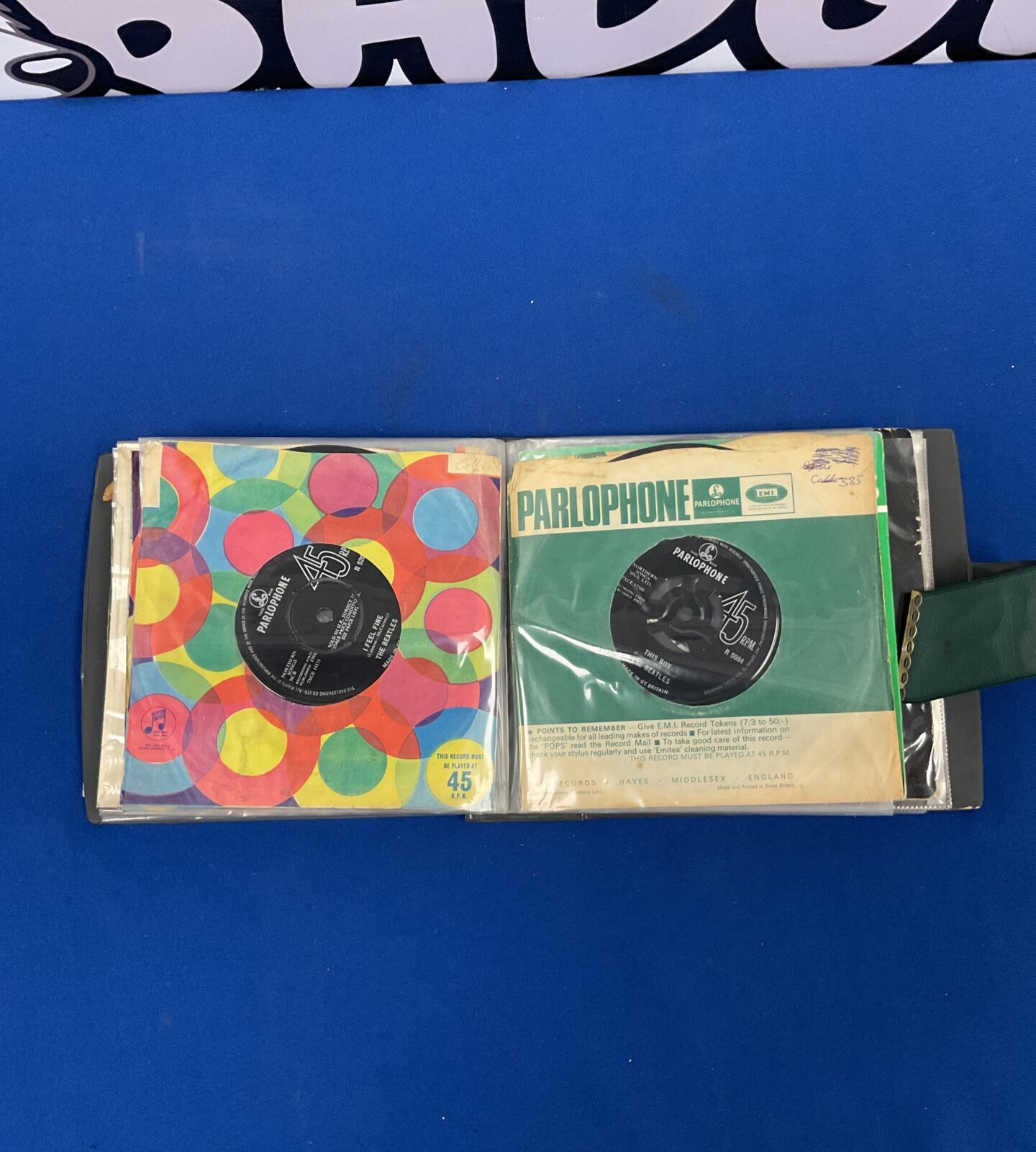 Stack of vintage Beatles vinyl records.