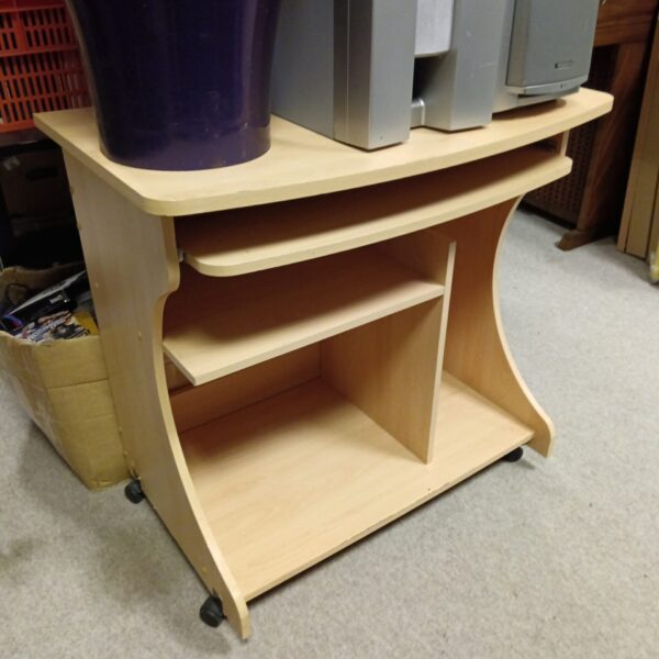 Vintage beechwood computer desk with caster wheels for easy mobility.