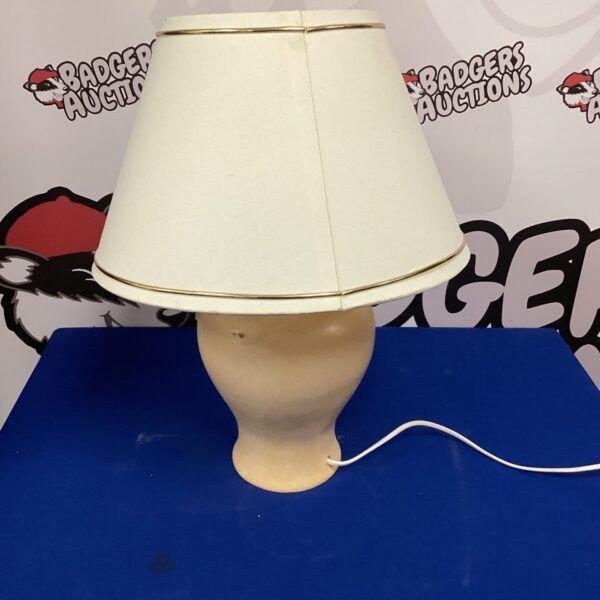 Vintage beige table lamp with a classic design.