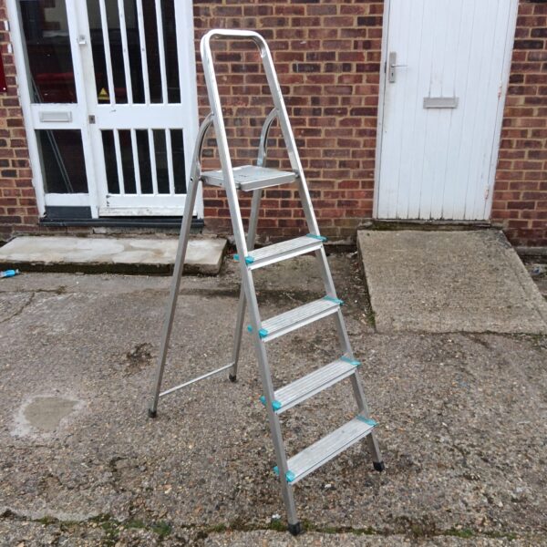 Silver Beldray aluminium step ladder against a white door.