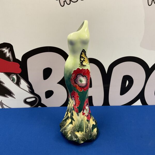 Signed Benaya ceramic vase with butterfly and floral design.