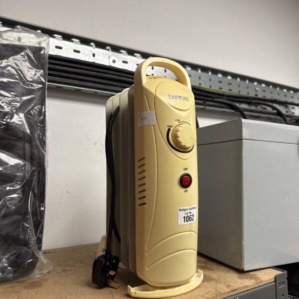 White Benross electric heater with dial control.