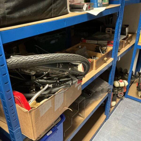 Assorted bicycle spares and accessories in five cardboard boxes.