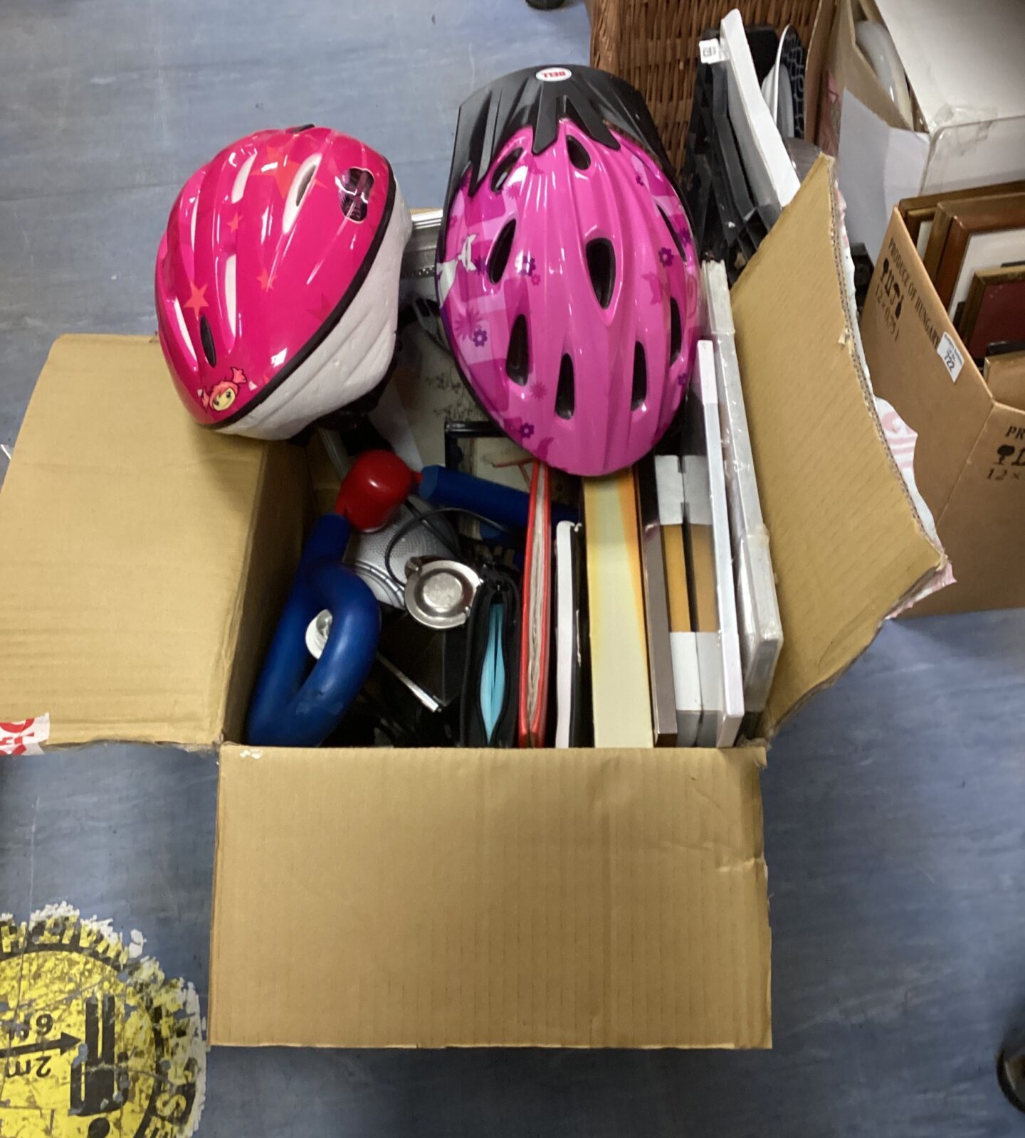Mixed lot of colourful bike helmets for cycling safety.