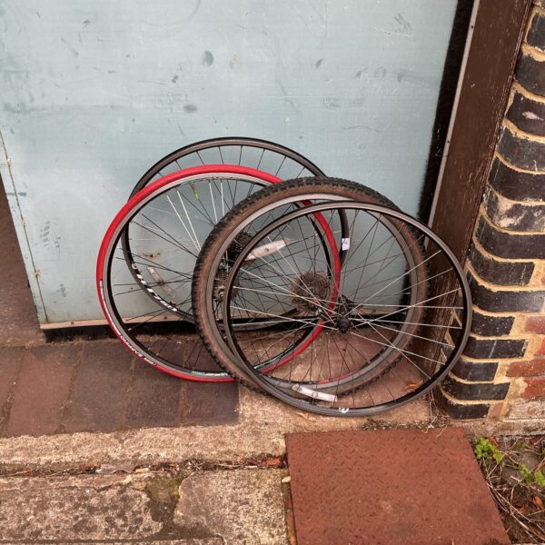 Set of four used bike wheels for cycling.