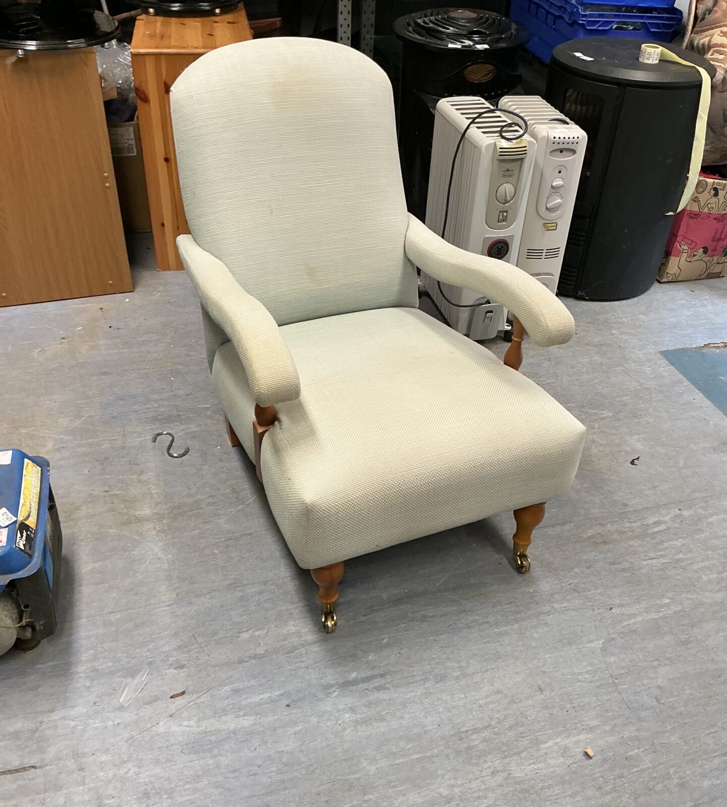 Cream upholstered vintage Billow and Co armchair with wooden legs.