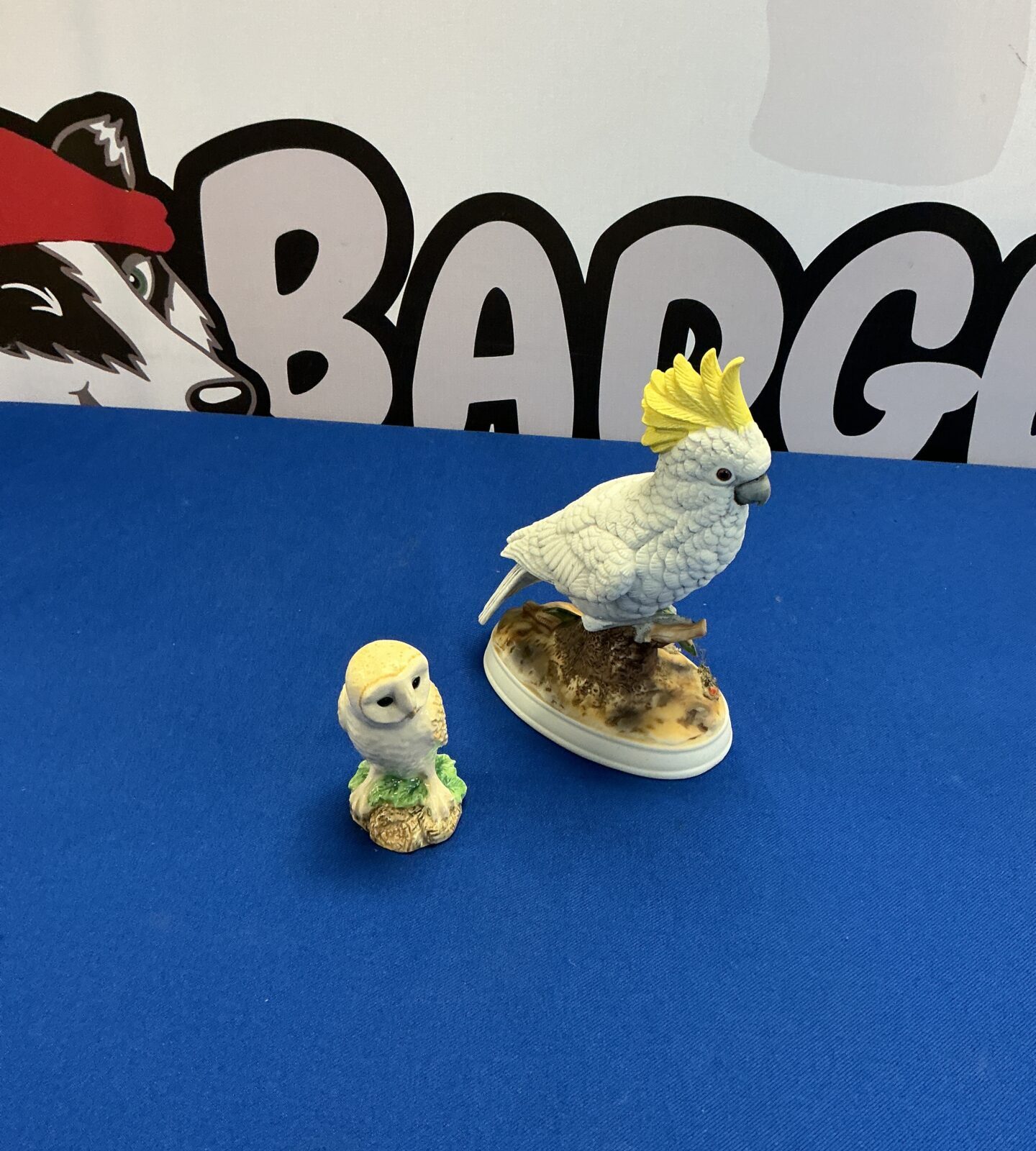 Vintage bisque porcelain cockatoo figurine with owl detail.