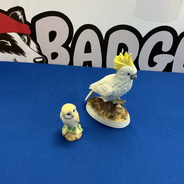 Vintage bisque porcelain cockatoo figurine with owl detail.