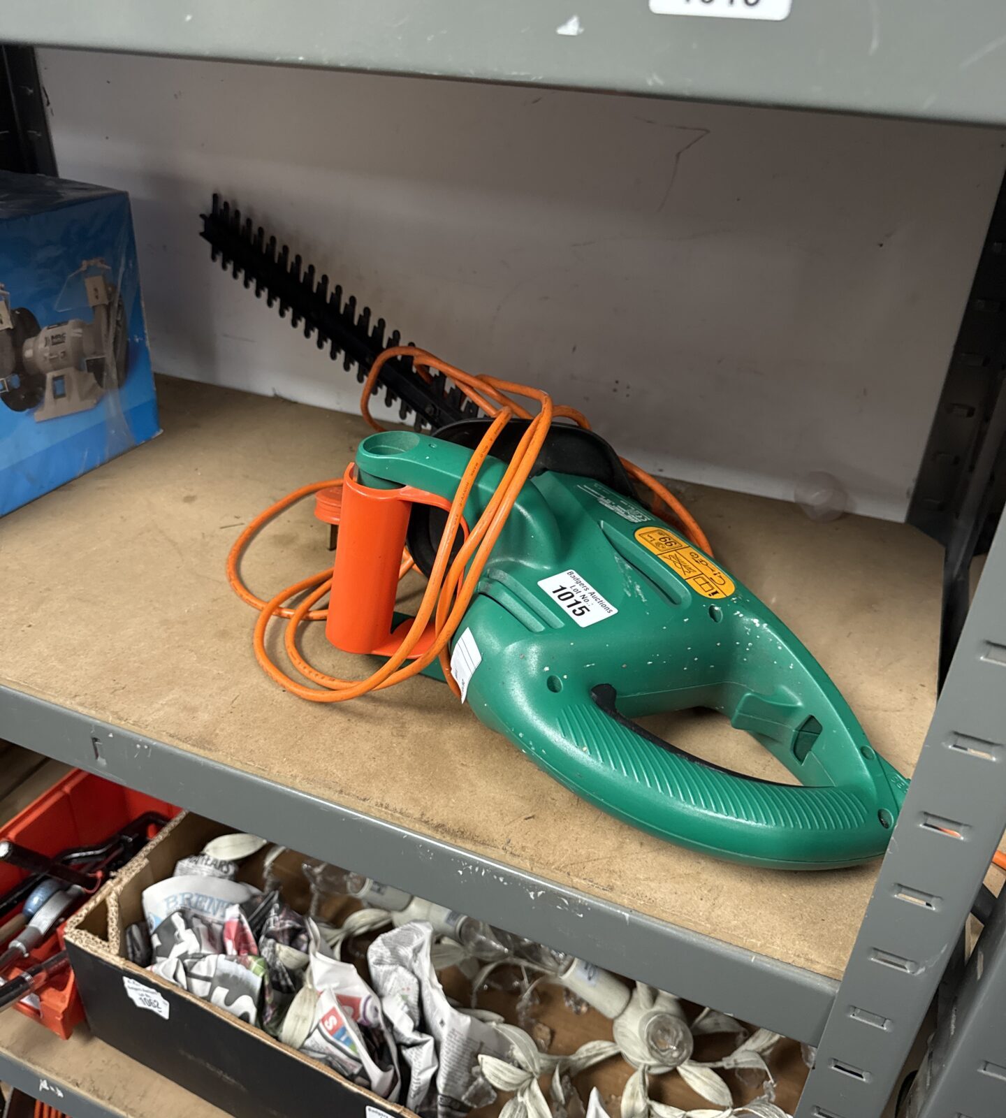 Black & Decker electric hedge cutter for garden maintenance.