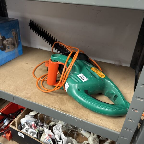 Black & Decker electric hedge cutter for garden maintenance.