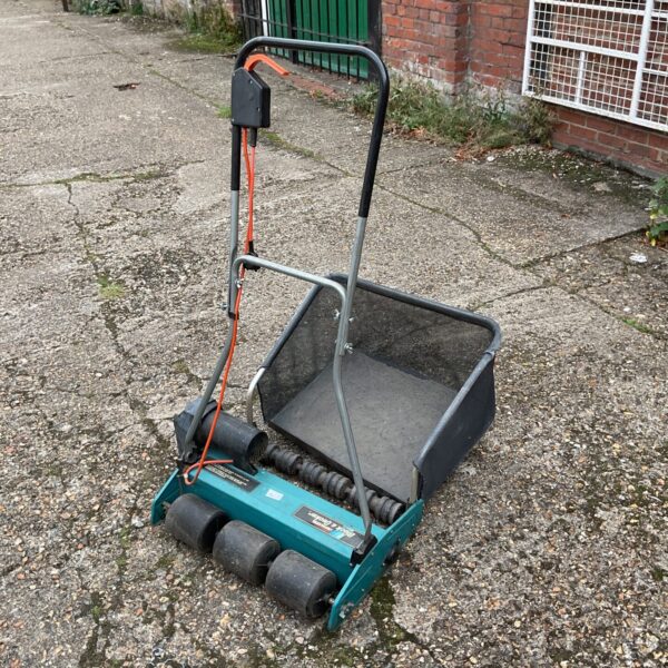 Vintage Black & Decker LR2000 lawn raker for garden maintenance.