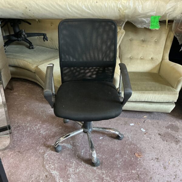 Black mesh office chair with swivel base and casters.