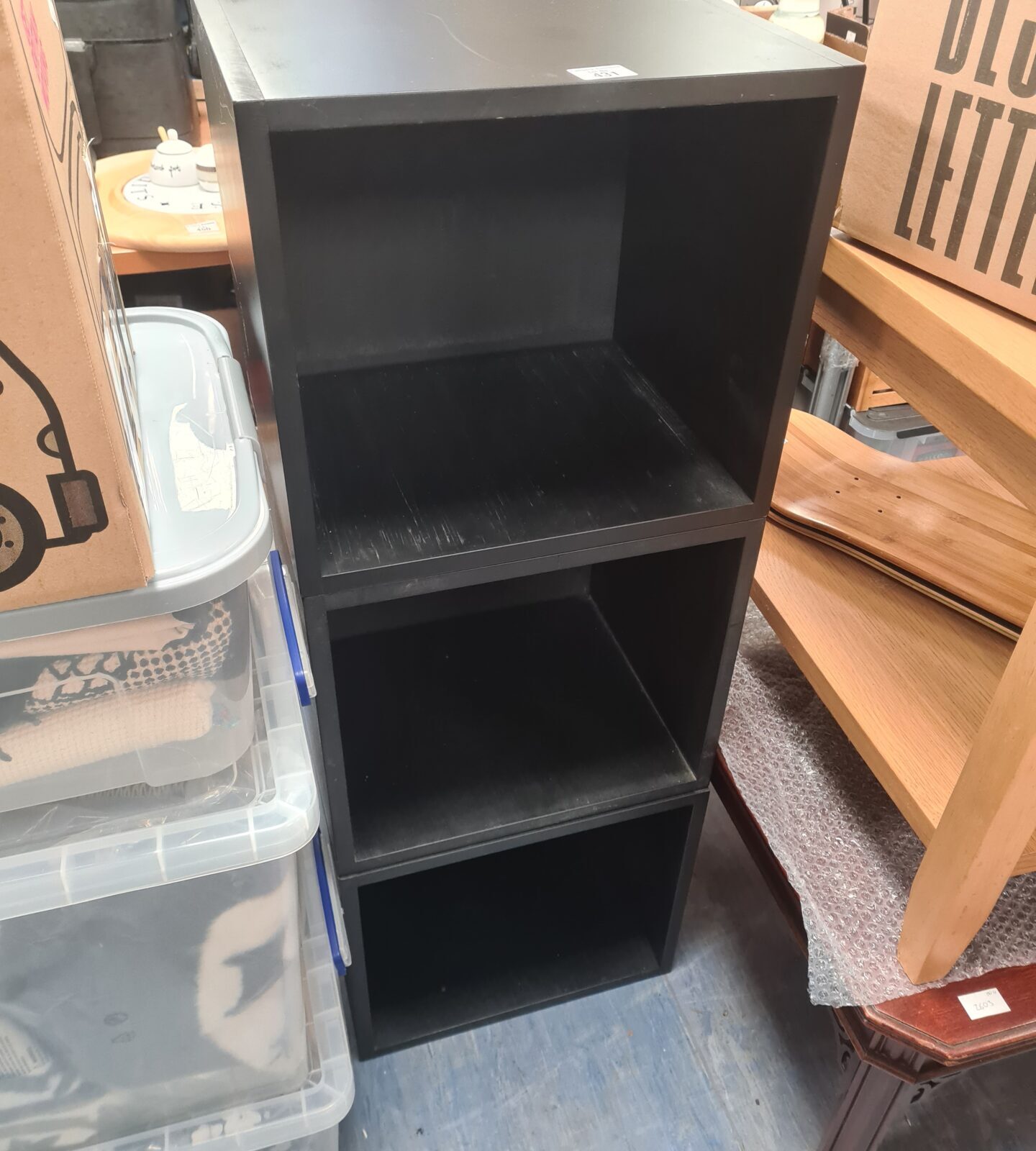 Black vinyl record storage boxes, modern design for music collection.