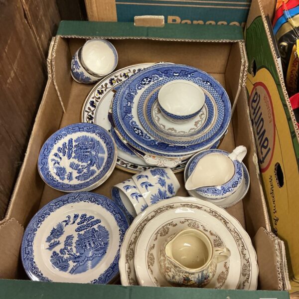 Vintage blue and white china lot with various plates and dishes.