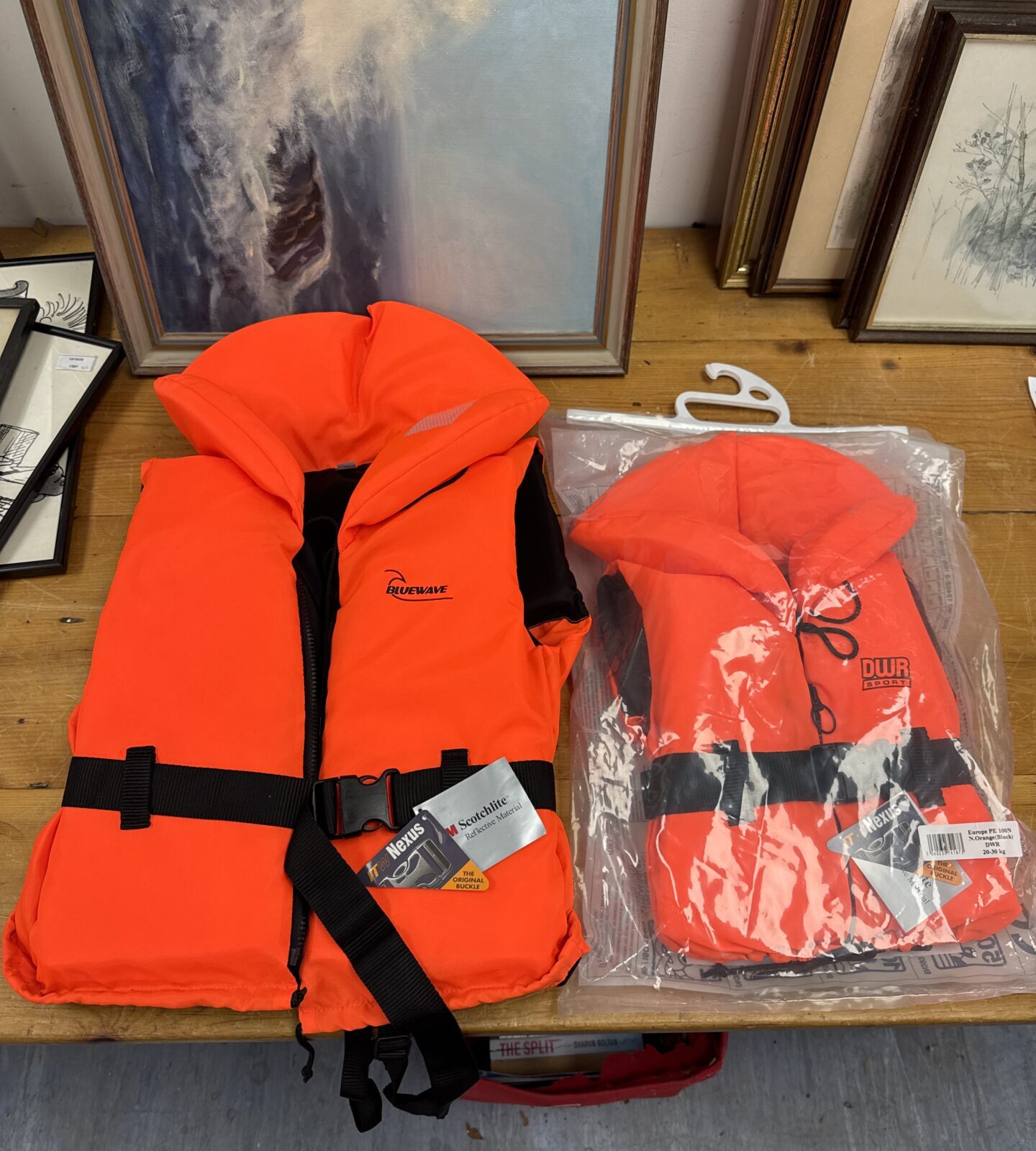 Bright orange Bluewave & DWR Sport life jacket for children or ladies.