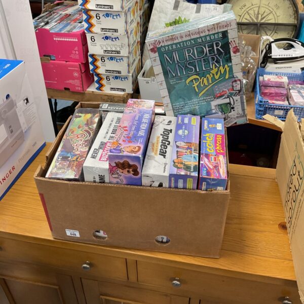 Mixed lot of board games, including new and used titles.