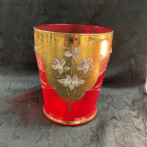 Vintage Bohemian cranberry glass vase with hand-painted flowers.