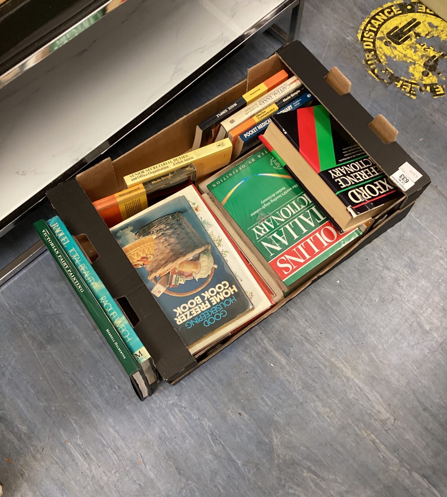 Vintage book lot with an Oxford dictionary and various paperbacks.