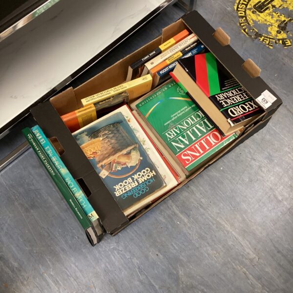Vintage book lot with an Oxford dictionary and various paperbacks.