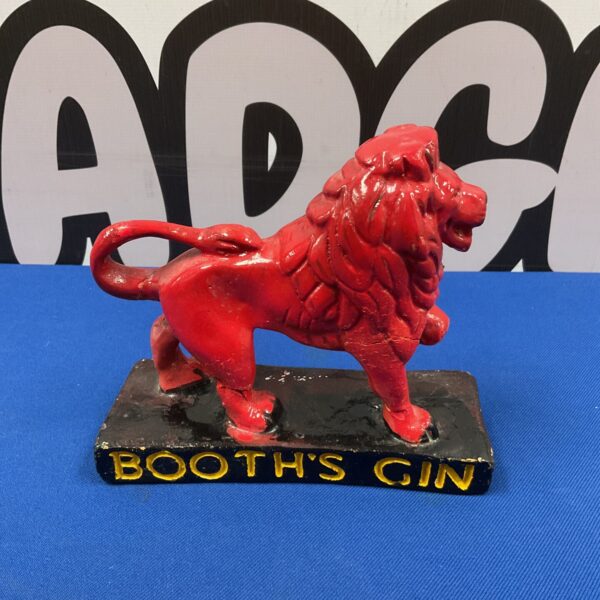 Vintage red chalkware lion advertising Booth's Gin.