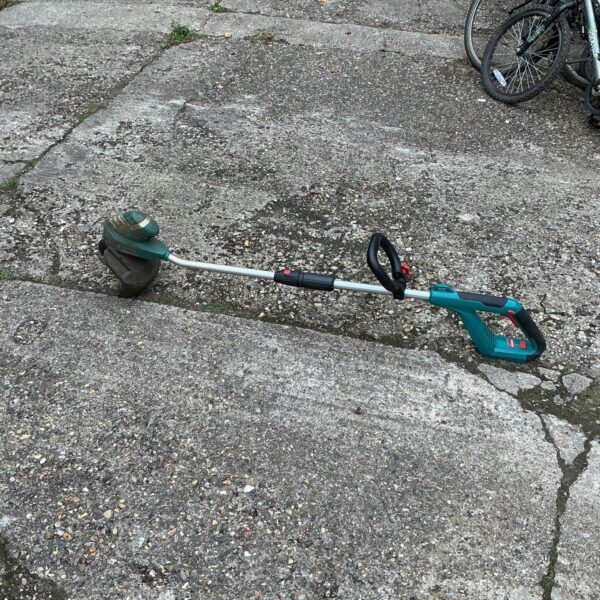 Bosch cordless strimmer for garden edging and weed control.