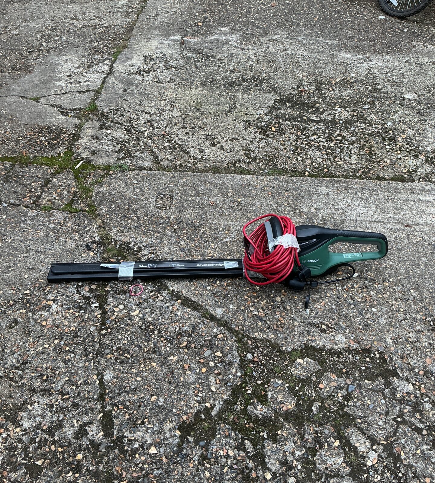 Bosch electric hedge cutter with 700mm blade for garden trimming.