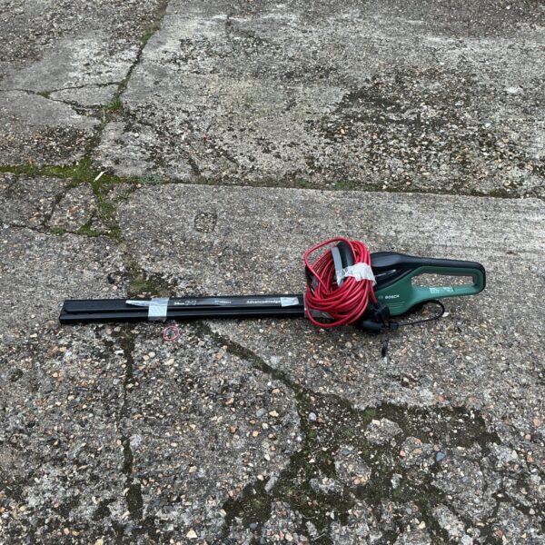 Bosch electric hedge cutter with 700mm blade for garden trimming.