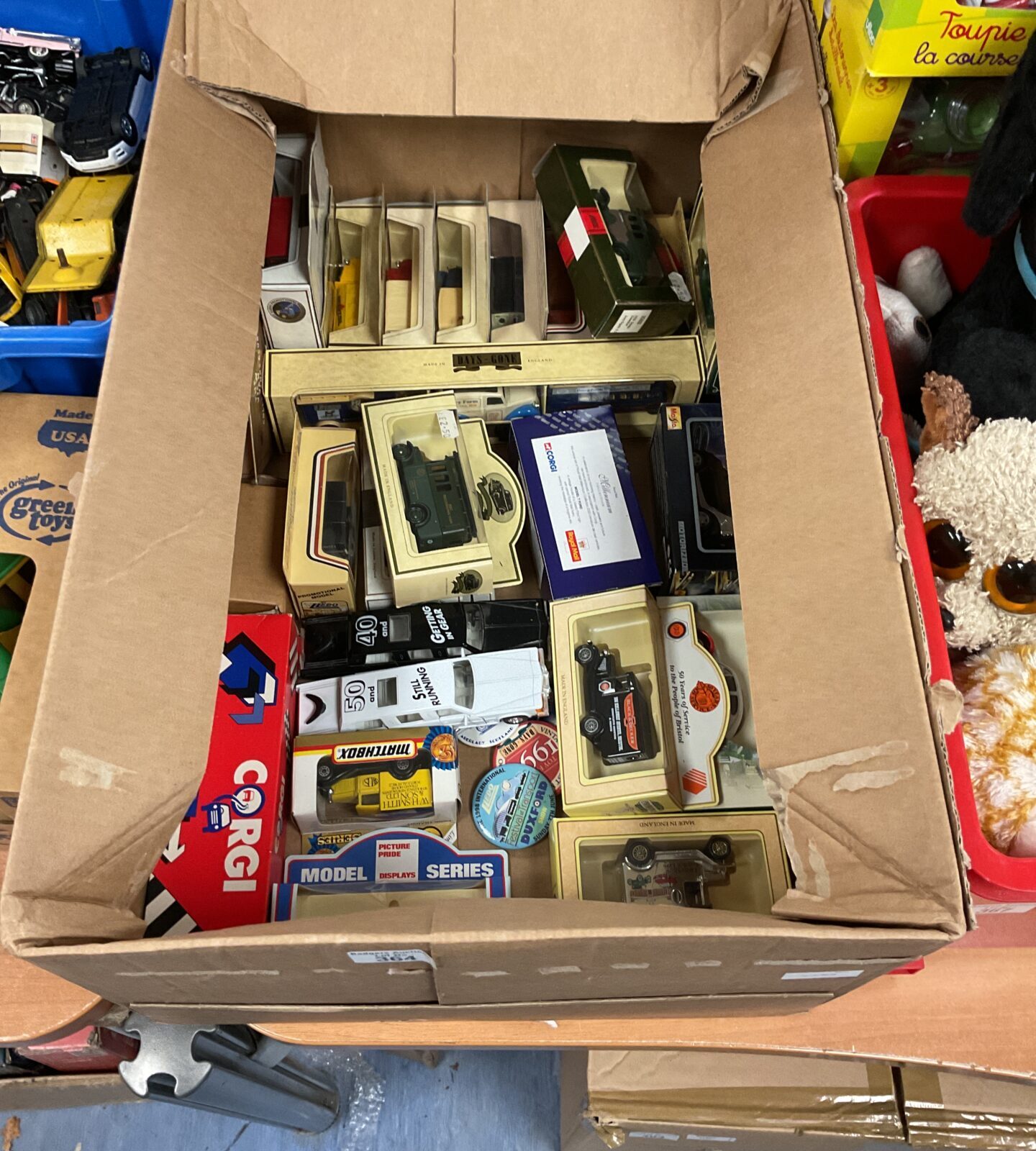 Boxed diecast model cars, including Corgi, in a vintage lot.