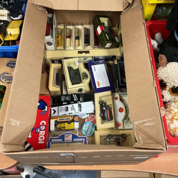 Boxed diecast model cars, including Corgi, in a vintage lot.