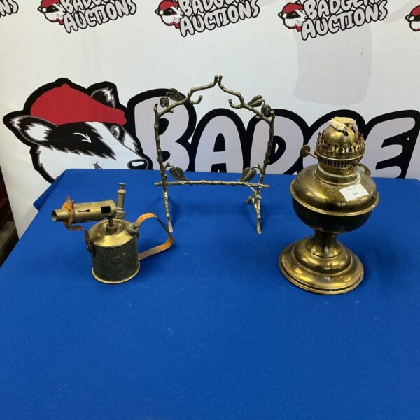 Vintage brass blow torch lamp with adjustable nozzle.