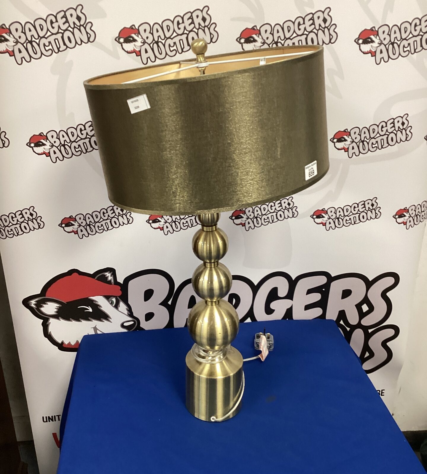 Vintage brass table lamp with shade, classic home decor.