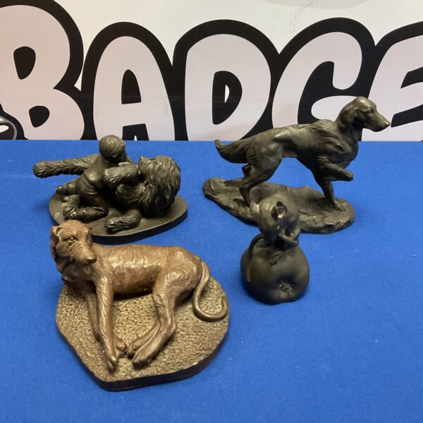 Detailed bronze resin lion ornament on textured base.