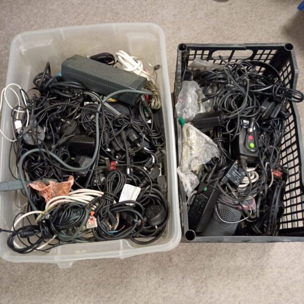 Mixed lot of cables and power supplies for gaming and electronics.