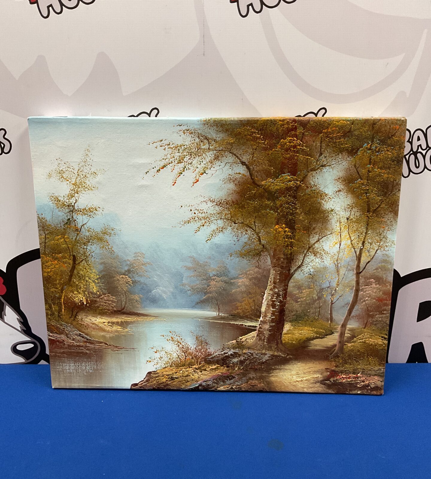 Signed Cafieri oil painting of an autumnal river landscape scene.