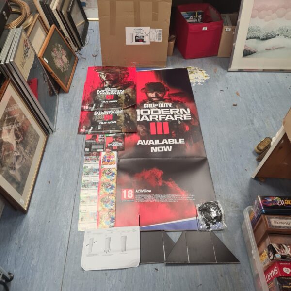 Call Of Duty Modern Warfare III display lot with poster and balloons.