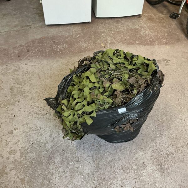 Large lot of camouflage netting for outdoor use.
