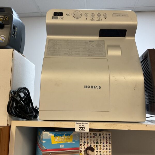 Canon LV-8235 ultra-short throw projector for home theater setup.