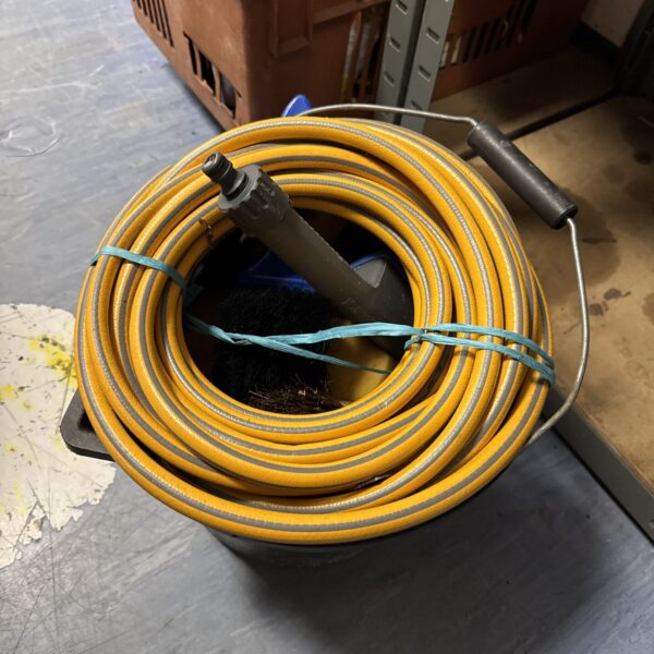 Yellow hosepipe and blue bucket in a car cleaning bundle.