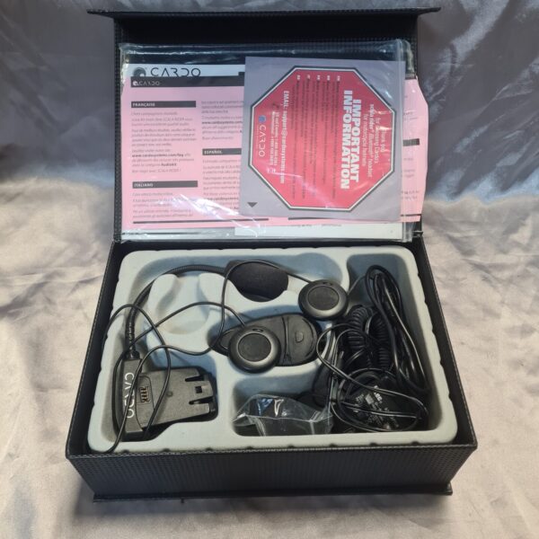 Cardo motorcycle communication system kit in carrying case.