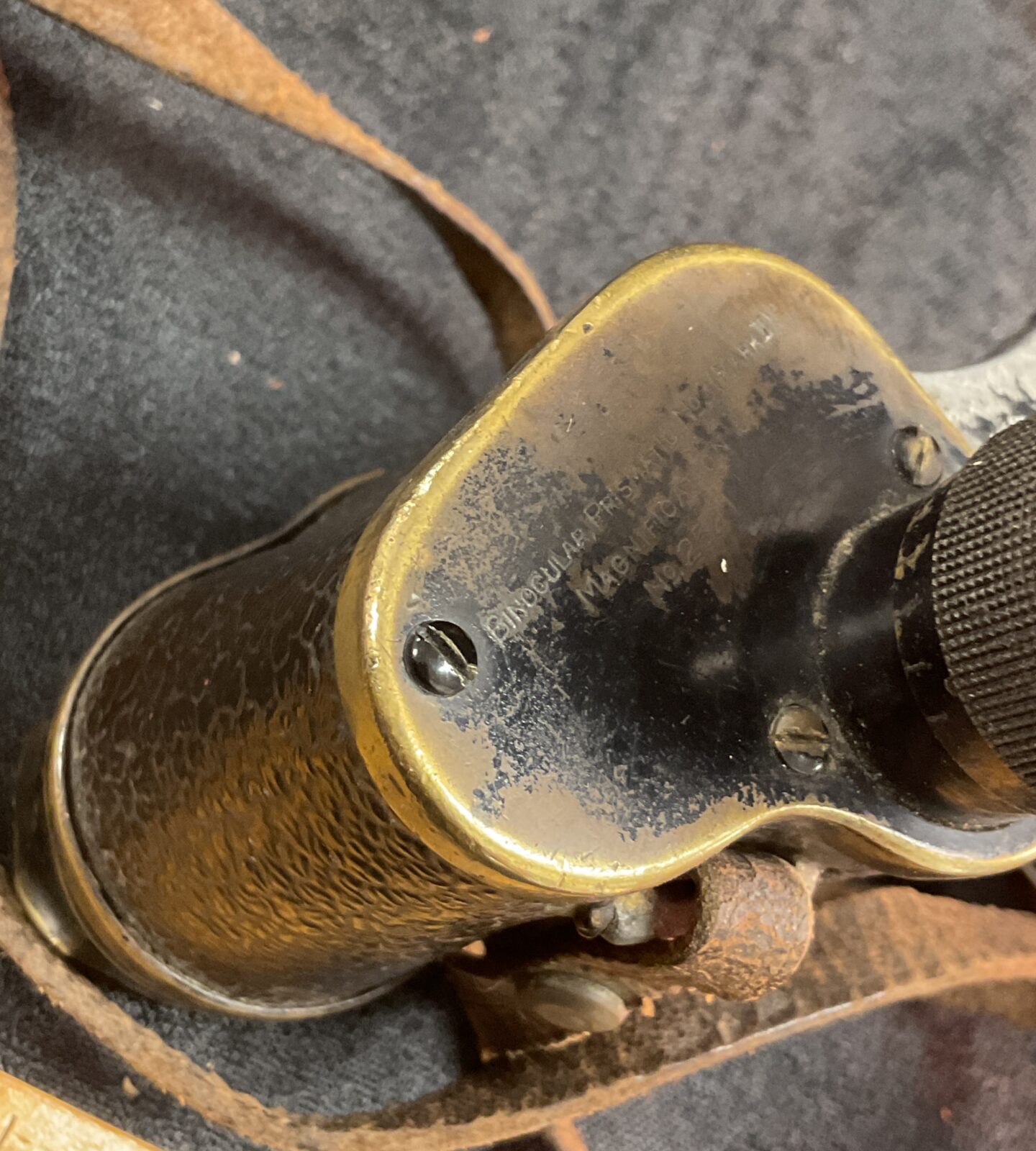 Side view of antique Carl Zeiss binoculars with markings.