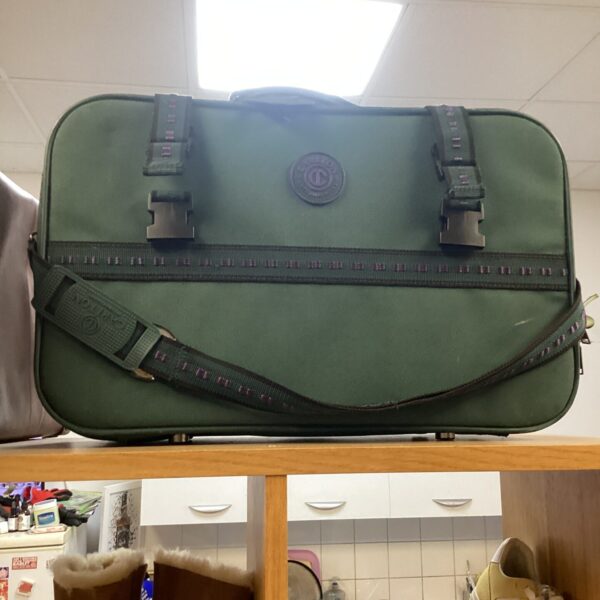 Vintage green Carlton International suitcase with shoulder strap.