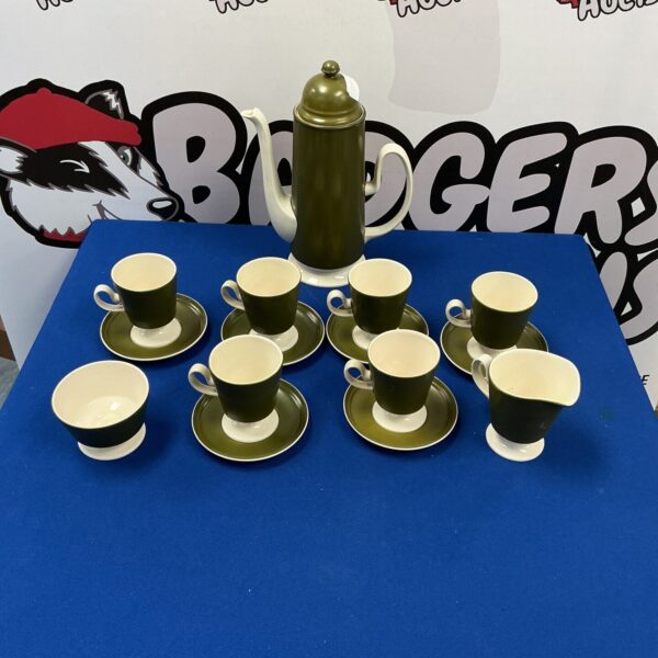 Vintage Carlton Ware coffee set with multiple cups and saucers.