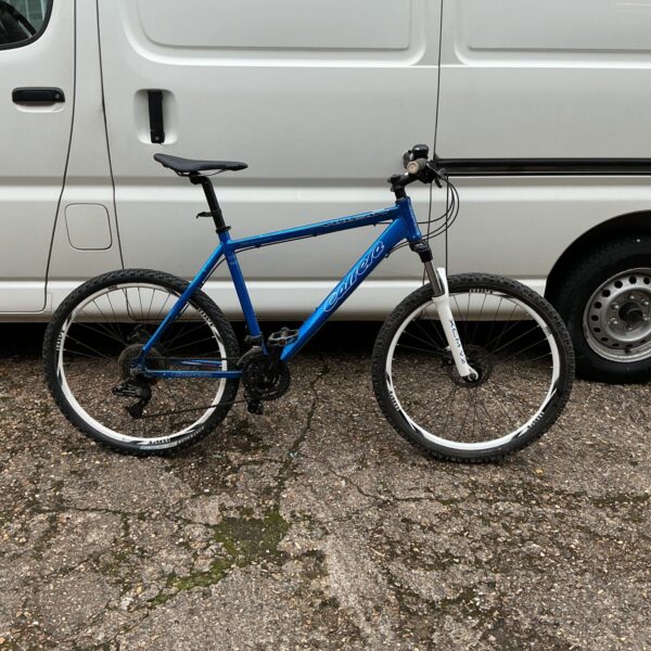 Blue Carrera Vulcan mountain bike for off-road adventures.