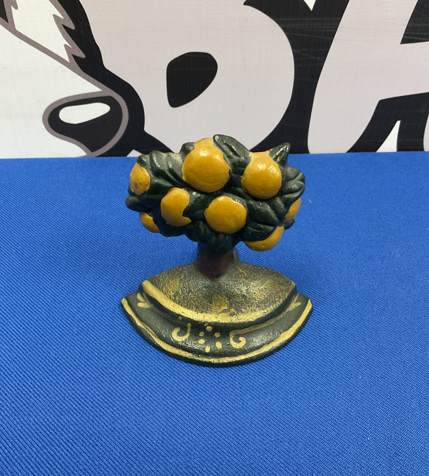 Vintage cast iron lemon tree doorstop for home decor.