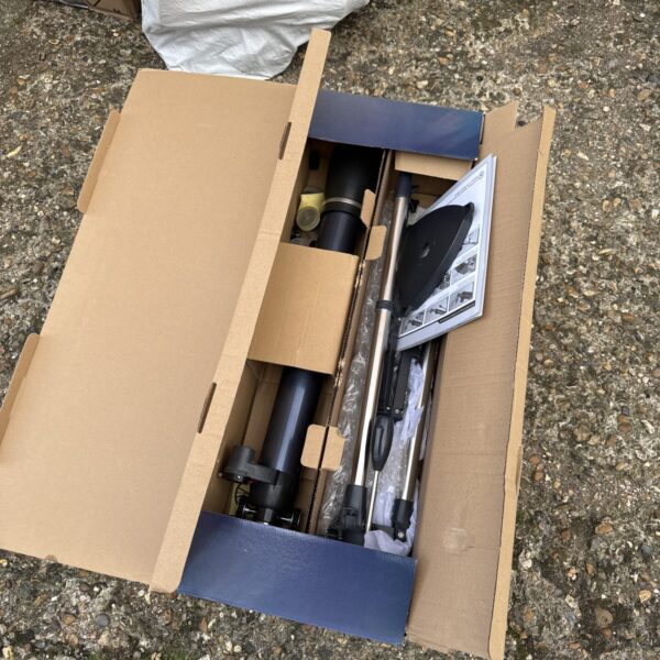 Celestron Astromaster XL telescope in its box, ready for exploration.