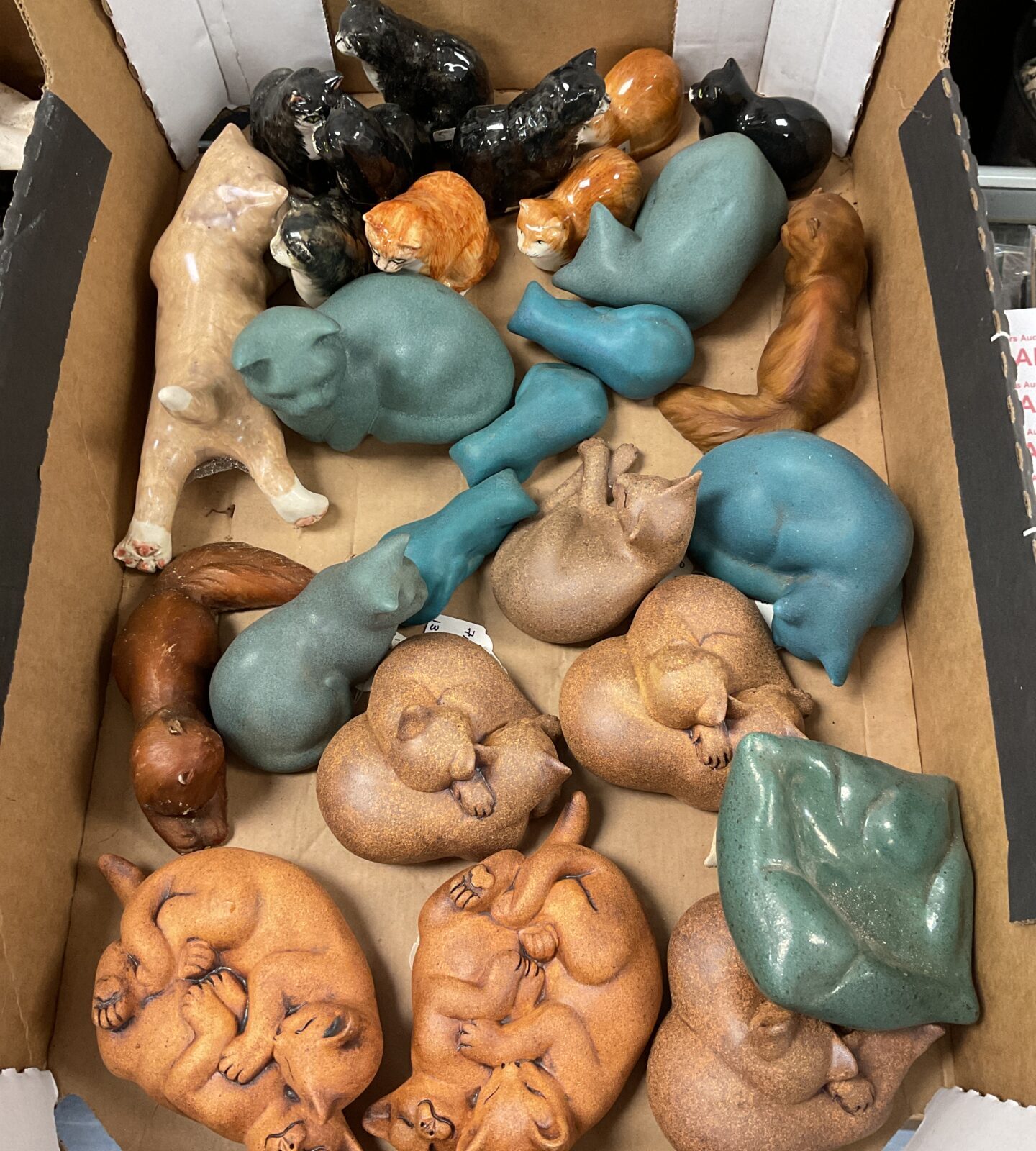 Large collection of vintage ceramic cat figures in various colours.