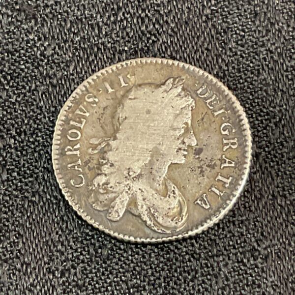 Charles II shilling 1663, silver coin with king's portrait.