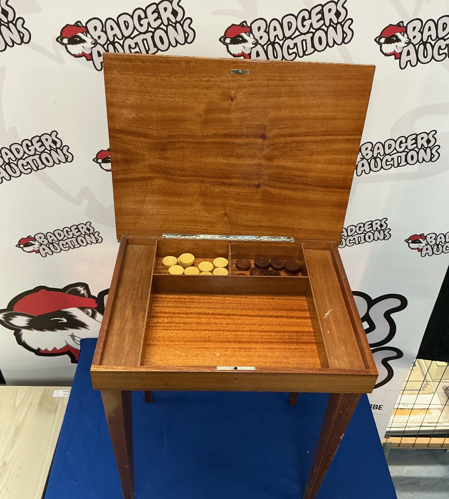 Side view of the vintage chessboard table with checkered top.